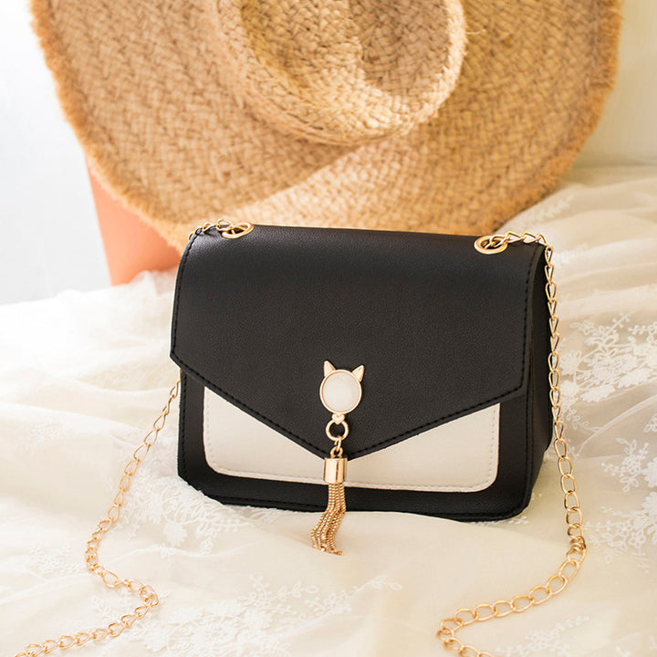 Liten crossbody-veske med kattelås i rosa