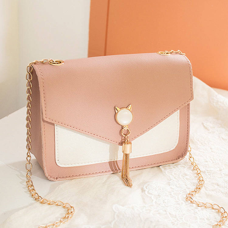 Liten crossbody-veske med kattelås i rosa