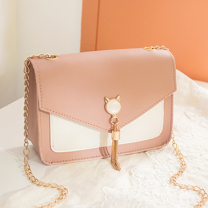 Liten crossbody-veske med kattelås i rosa